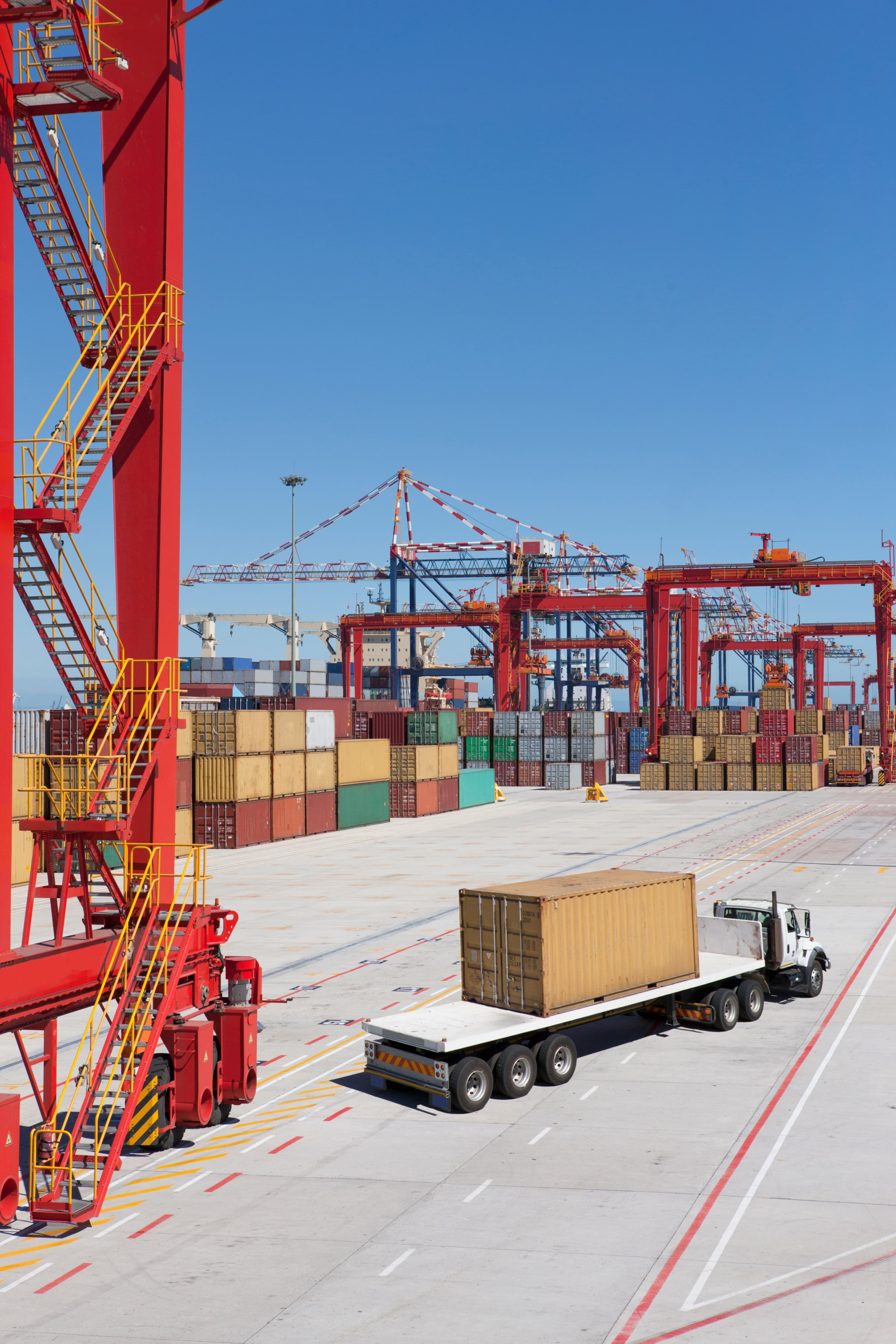 Shipping port with containers and cranes